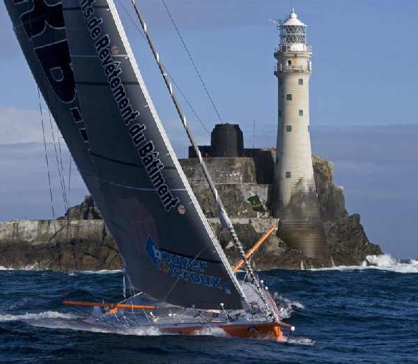  Vincent Riou's PRB, the first IMOCA Open 60 at the Fastnet Rock; Copyright: Rolex, Daniel Forster 