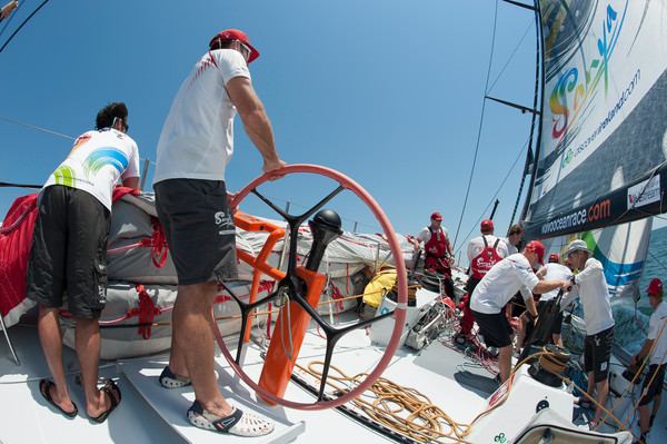 Mike Sanderson helming as Team Sanya sail their Volvo Open 70 from Savannah to Miami for the PORTMIAMI In-port Race and the start of leg 7, during the Volvo Ocean Race 2011-12. (Credit: PAUL TODD/Volvo Ocean Race) 