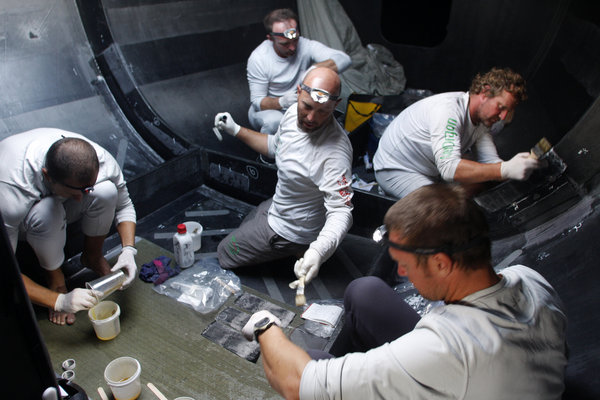 Tom Braidwood leads the crew in repairing damage sustained in 50 knot winds, on leg 4 of the Volvo Ocean Race, from Singapore to Qingdao, China - Photocredit: Guo Chuan/Green Dragon Racing/Volvo Ocean Race